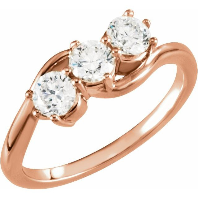 A three-stone ring, also known as a trilogy or trinity ring, symbolizes the past, present, and future of a relationship. The center stone represents the present, while the side stones represent cherished memories from the past and the promise of a future together.