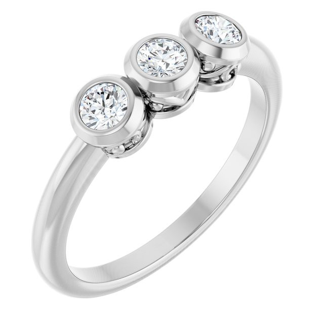 A three-stone ring, also known as a trilogy or trinity ring, symbolizes the past, present, and future of a relationship. The center stone represents the present, while the side stones represent cherished memories from the past and the promise of a future together.