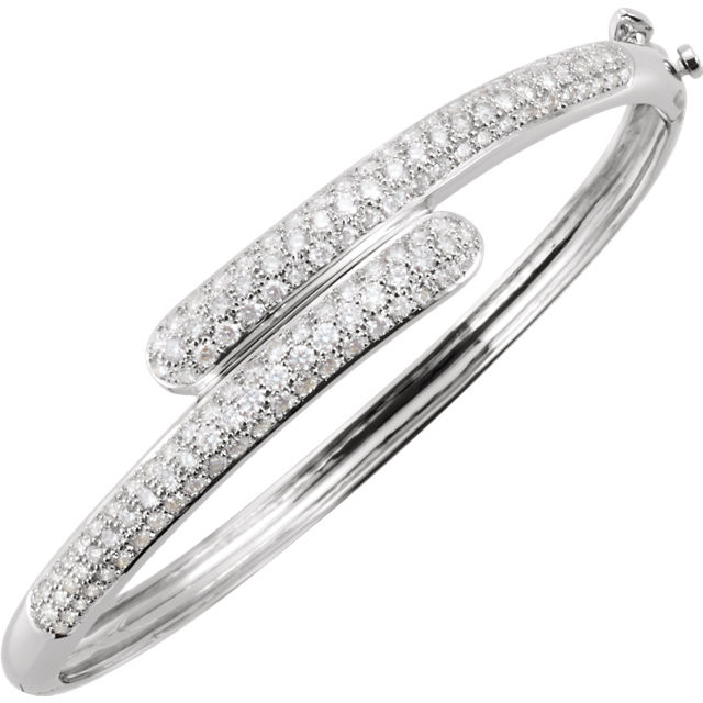 Simple, sleek and super stylish, this diamond bangle bracelet elevates any attire. Fashioned in 14K White Gold, this bracelet shimmers with a 3 ct. t.w. of shimmering white diamonds. For everyday posh style, this 7.0-inch accessory elegantly bypasses across the top of your wrist.