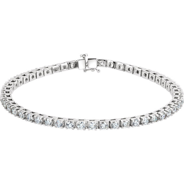 Elegant and refined, this diamond bracelet is a winner all around. Beautifully crafted in platinum, this stunning style is prong-set with an amazing 5 cts. t.w. of 50 shimmering round diamonds, each with a color ranking of G-H and a clarity of SI1. An exceptional design, this bracelet measures 7 1/4 inches in length and secures with a tongue and groove clasp. 