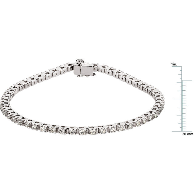 A classic look just for her, this diamond tennis bracelet is certain to take her breath away. Fashioned in cool 14K white gold, this timeless design features an awe-inspiring 2 1/8 cts. t.w. of prong-set round diamonds, each with a color ranking of G-H and a clarity of I1, arranged in clever squared links. A sophisticated style, this 7.0-inch bracelet is polished to a brilliant shine and secures with a tongue and groove clasp.