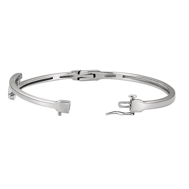 This 14K white gold fine bangle bracelet features three square princess diamonds in a prong setting. The bangle is 7.0 inches in circumference.