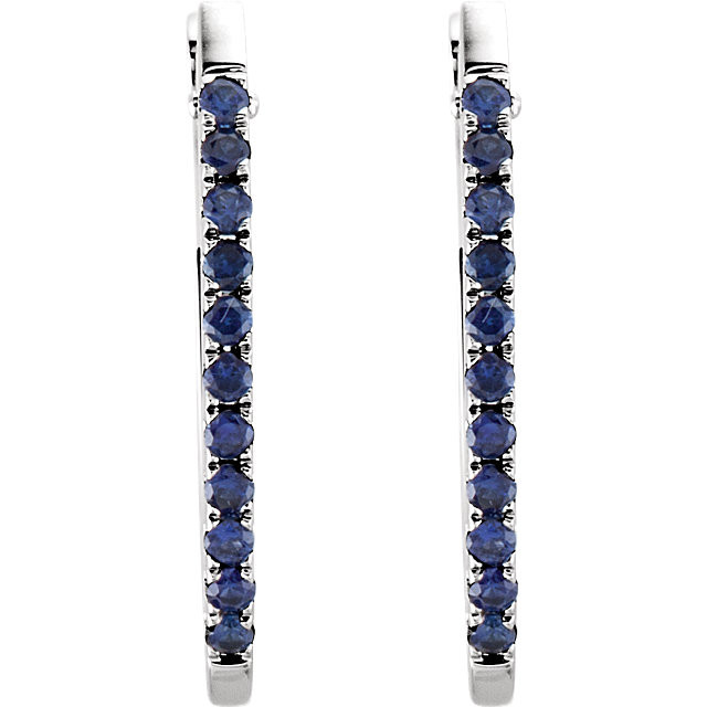 Perfect for the woman who appreciates color, these hoop earrings will take her breath away. Fashioned in 14K white gold, these hoop earrings are set with shimmering round blue sapphires along the outside edges. With color and sparkle evident from every angle, these earrings are a great look any time. Polished to a brilliant shine.