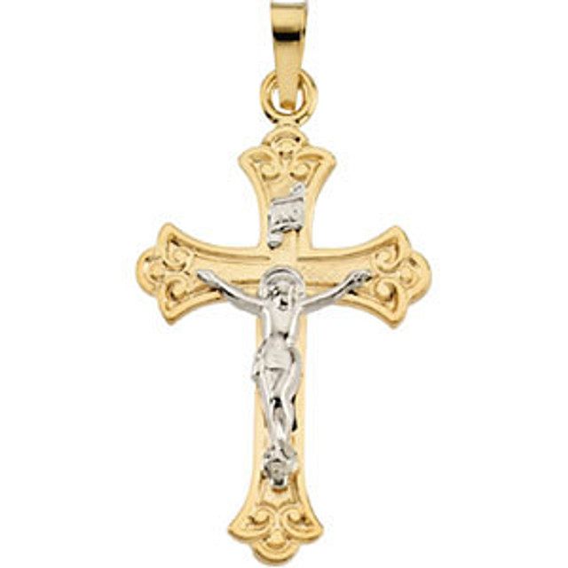 Delicate in design, this crucifix pendant is crafted in 14k yellow gold and measures 27.75x18.00mm.