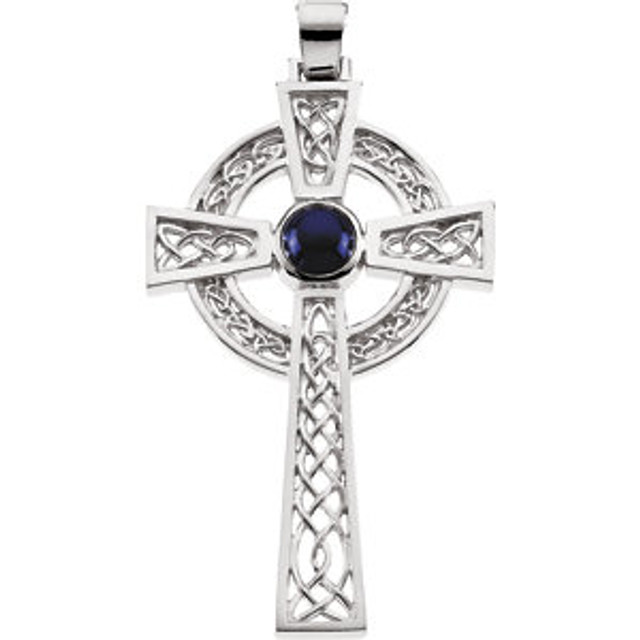 This magnificent, star sapphire celtic cross pendant is crafted from high-polished sterling silver and features an intricate, open knot-work design. In the center of the cross rests a single, 7mm round, lab-created star sapphire cabochon, bezel-set in sterling silver.  Measures approximately 2-1/16" in length, and includes a 18" sterling silver chain.