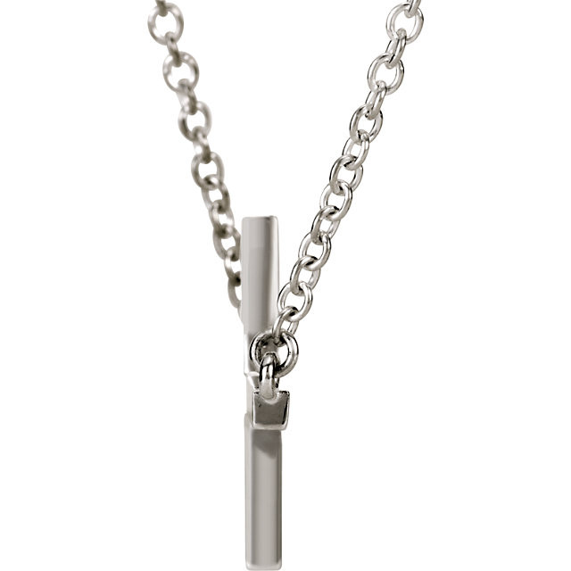This sideways cross necklace is crafted from high-polished 14K white gold. The cross measures approximately 1-1/8" in length. The total length with the chain is 16" plus a 2" extension. Secured with a spring-ring clasp.