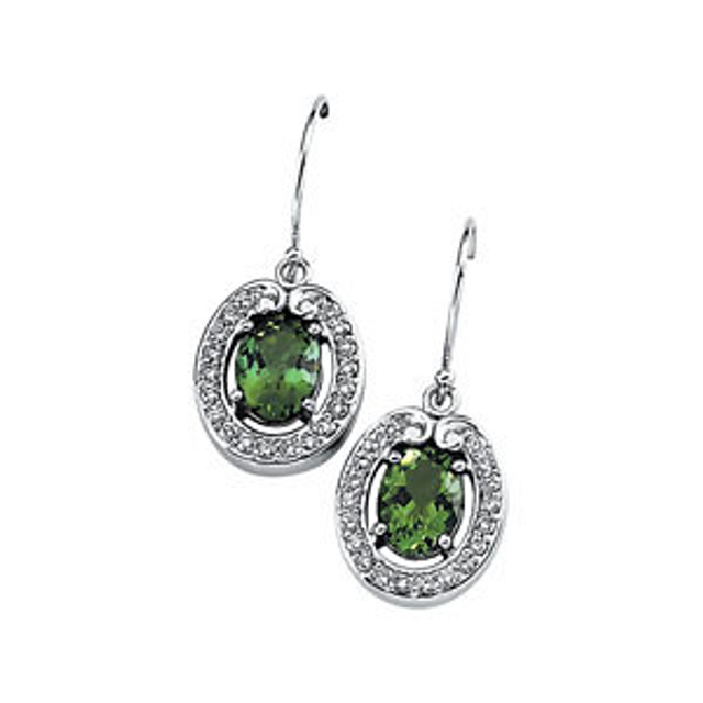 Pretty, fresh and perky, these glittering green tourmaline and 3/8 ct. t.w. diamond drop earrings create a sparkling and irresistable display. They feature two green tourmaline oval outlined in round brilliant-cut diamonds for an exquisite display.