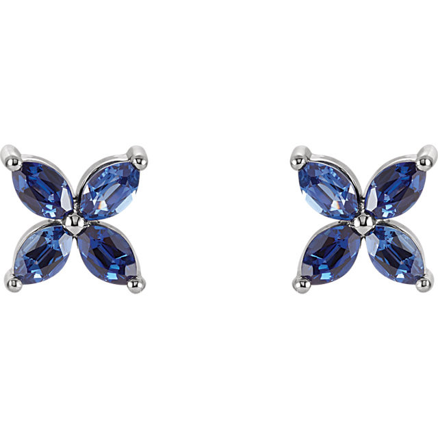 An alluring lab-created blue sapphire makes a vibrant statement in each of these stylish earrings for her. Crafted in 14K white gold, These fine jewelry earrings are secured with friction backs. 