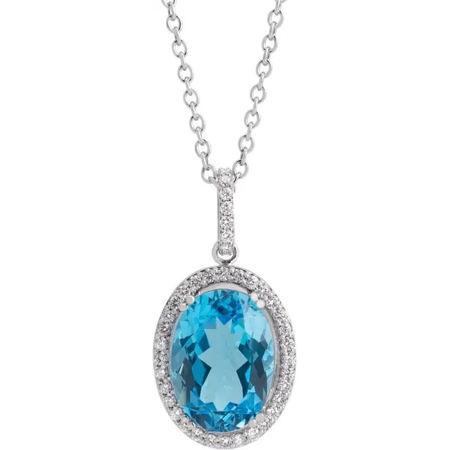 Turn your favorite birthstone into the most sophisticated look with this oval-shaped blue topaz and diamond frame pendant.