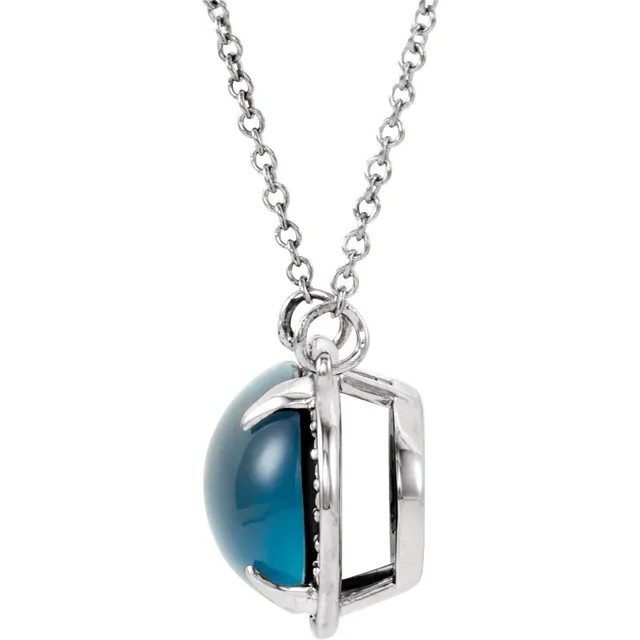 The halo-style pendant of this fabulous necklace for her is decorated with a vivid blue topaz and twinkling round diamonds totaling .08 carat in weight.