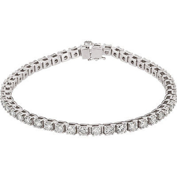 Beautifully crafted, this diamond tennis bracelet features forty-six round, brilliant cut diamonds that are set in a four-prong straight line design.