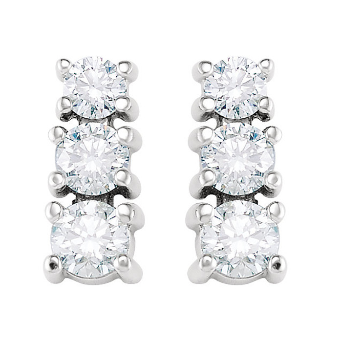 Bold and brilliant, these diamond 3 stone earrings are a sparkling look, perfect for that special evening out. Crafted in cool 14K white gold, each earring features three shimmering prong-set diamonds that are G-H in color and I1 or better in clarity. Radiant with 9/10 ct. t.w. of diamonds and polished to a brilliant shine, these post earrings secure comfortably with friction backs.