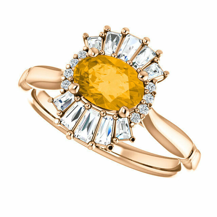 Crafted in 14k rose gold, this ring features one oval Genuine Citrine gemstone accented with 18 genuine diamonds.