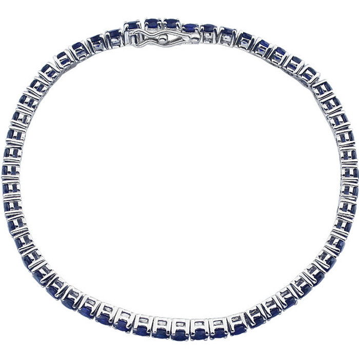 Dress her wrist in glittering style. Fashioned in 14K white gold, this exquisite bracelet pairs 3.0mm round-shaped blue sapphires, the traditional birthstone for September. The bracelet measures 7.25 inches in length.