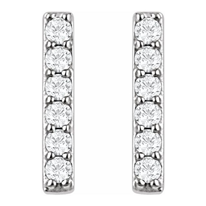 These fashionable earrings are pave set with stunning white diamonds to create an elegant glitter. The lustrous platinum setting enhances the beauty, and creates a simple yet luxurious vertical bar.