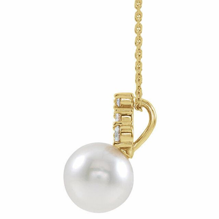 Our highest-quality Freshwater cultured pearl is paired with five brilliant round diamonds and attached to an 14k yellow gold bail. The pair suspend from a delicate 14k yellow gold 16-18" cable chain. Diamonds are G-H in color and I1 or better in clarity.