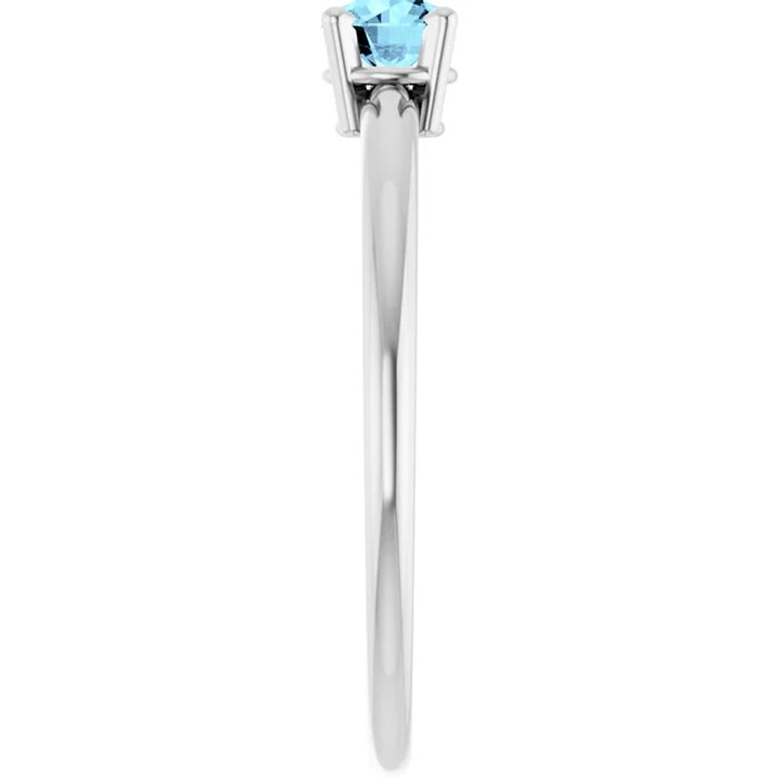 Dainty and feminine, this gemstone ring sets an elegant tone. The ring is set in platinum.