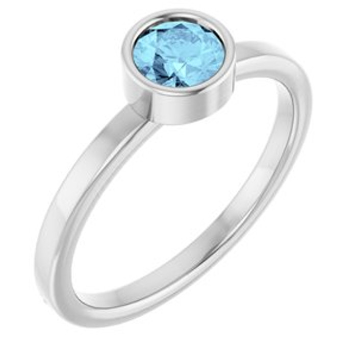 Dainty and feminine, this gemstone ring sets an elegant tone. The ring is set in platinum.