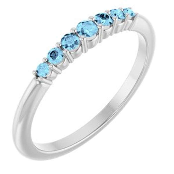 Dainty and feminine, this gemstone ring sets an elegant tone. The ring is set in platinum.