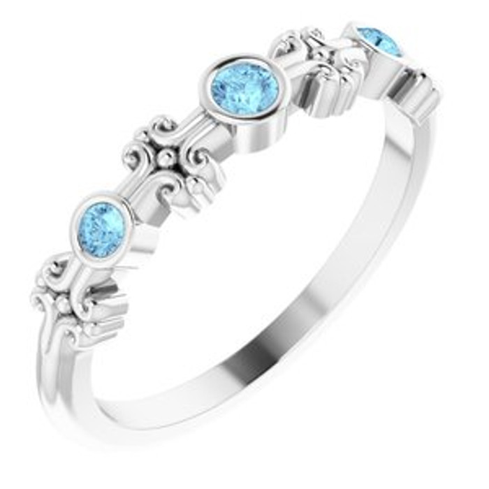 Dainty and feminine, this gemstone ring sets an elegant tone. The ring is set in platinum.