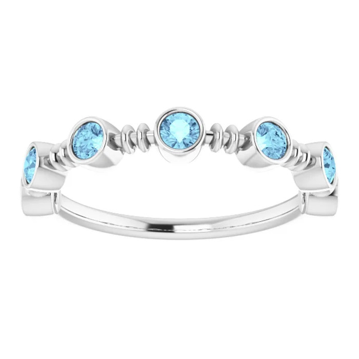 Dainty and feminine, this gemstone ring sets an elegant tone. The ring is set in platinum.