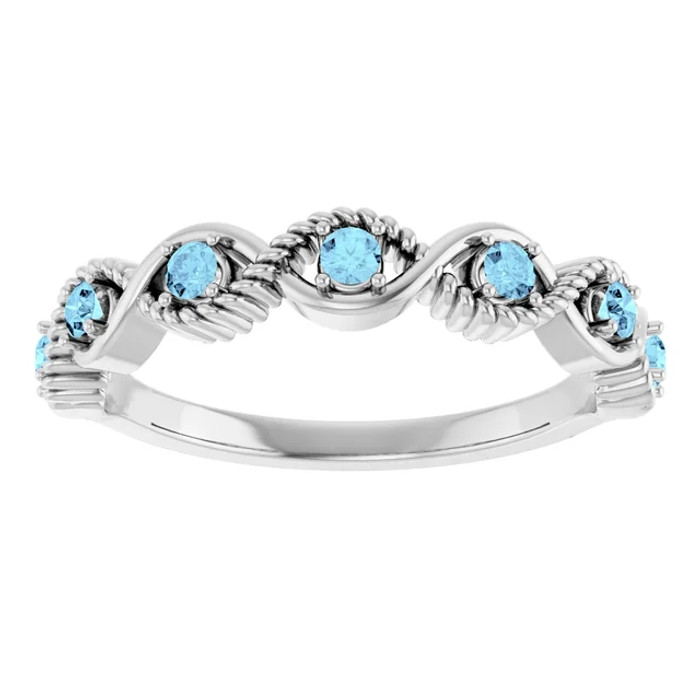 Dainty and feminine, this gemstone ring sets an elegant tone. The ring is set in platinum.