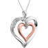 This 14K Rose Gold/Sterling Silver pendant features a romantic heart inside of a heart adorned with round diamonds. Diamonds are .06ctw, G-I in color, and I3 or better in clarity. Pendant is 32mm in diameter and is presented on an 18 inch sterling silver rope chain.