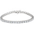 This fabulous 7.00 ct. t.w. diamond tennis bracelet is a breathtaking piece that we really love. Sparkling and sensational, it's a classic that features a stream of round full cut diamonds so gorgeous that it will have heads turning for a second look. 18kt white gold bracelet. 
