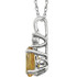 Exquisite 14Kt white gold pendant captures the beauty of a genuine 7x5mm oval Citrine accented by white shimmering diamonds hanging from an 18" inch necklace.Total weight of the diamonds is 0.02 total carat weight.