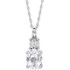 Exquisite 14Kt white gold pendant captures the beauty of a genuine 7x5mm oval Created White Sapphire accented by white shimmering diamonds hanging from an 18" inch necklace. Total weight of the diamonds is 0.02 total carat weight.