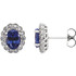 Exquisite platinum earrings capturing the beauty of radiant created blue sapphires and a total carat weight of 3/8 total carat weight of diamonds.