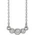 Beautiful platinum graduated bezel set 1/8 ct. tw. diamond necklace hanging from a 16-18" inch chain which is included.