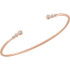 This graduated bangle bracelet showcases round diamonds set in 14k rose gold.