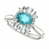 Crafted in 14k white gold, this ring features one oval Genuine Blue Zircon gemstone accented with 18 genuine diamonds. 