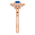 Crafted in 14k rose gold, this ring features one oval Genuine Blue Sapphire gemstone accented with 18 genuine diamonds. 