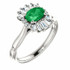 Crafted in platinum, this ring features one oval Genuine Emerald gemstone accented with 18 genuine diamonds. 