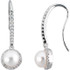 These elegant 14k white gold earrings each feature a white cultured pearl with diamond accents. Diamonds are 3/8ctw, H-I in color, and I1 or better in clarity. Polished to a brilliant shine.