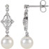 These elegant 14k white gold earrings each feature a 7mm freshwater cultured pearl with diamond accents. Diamonds are 1/6ctw, H-I in color, and I1 or better in clarity. 