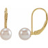With ease and elegance, these pearl drop earrings complete her tailored anytime attire.