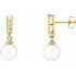 With ease and elegance, these classic pearl drop earrings complete her tailored anytime attire.