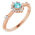 Crafted in 14k rose gold, this ring features a beautiful blue zircon and 14 round diamonds. Polished to a brilliant shine.