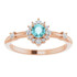 Crafted in 14k rose gold, this ring features a beautiful blue zircon and 14 round diamonds. Polished to a brilliant shine.