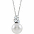 Our highest-quality Freshwater cultured pearl is paired with five brilliant round diamonds and attached to an 14k white gold bail. The pair suspend from a delicate 14k white gold 16-18" cable chain. Diamonds are G-H in color and I1 or better in clarity.