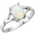 This 14K white gold ring features a stunning natural white opal cabochon, perfect for adding a touch of elegance to any outfit.