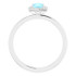 Dainty and feminine, this gemstone ring sets an elegant tone. The ring is set in platinum.