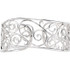 The openwork design of this sterling silver bracelet brings a fresh look to the classic cuff. Forty Six diamonds .25 ct. t.w. meet in the center of the elegant bracelet.