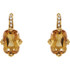 Elegant and dramatic, these captivating drop earrings are a statement look any woman would adore. Fashioned in 14K yellow gold, each earring showcases a 12.00x08.00mm citrine gemstones. The drop is adorned with shimmering diamond accents and polished to a fine shine, making this romantic gift the perfect birthday surprise.