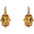 Elegant and dramatic, these captivating drop earrings are a statement look any woman would adore. Fashioned in 14K yellow gold, each earring showcases a 12.00x08.00mm citrine gemstones. The drop is adorned with shimmering diamond accents and polished to a fine shine, making this romantic gift the perfect birthday surprise.