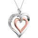 This 14K Rose Gold/Sterling Silver pendant features a romantic heart inside of a heart adorned with round diamonds. Diamonds are .06ctw, G-I in color, and I3 or better in clarity. Pendant is 32mm in diameter and is presented on an 18 inch sterling silver rope chain.