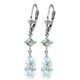 The light blue hues of aquamarine gemstones add soft and subtle elegance to any jewelry that they adorn. These 14k white gold leverback earrings with aquamarine stones look as heavenly as a clear blue sky. Two square shaped stones measuring at a full carat are draped from the solid gold leverbacks. Two additional pear shaped stones cascade down adding an additional three and a half carats of sparkling beauty. These earrings are subtle enough to wear in the office, but versatile enough to be worn for a night out on the town.